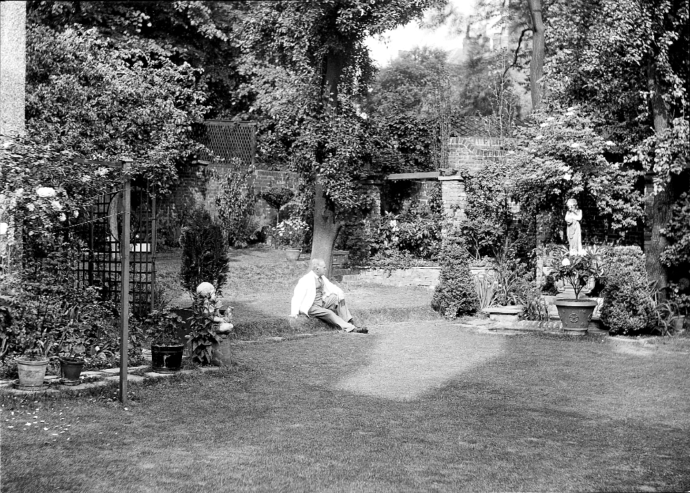 Gilbert Bayes Sitting in his garden